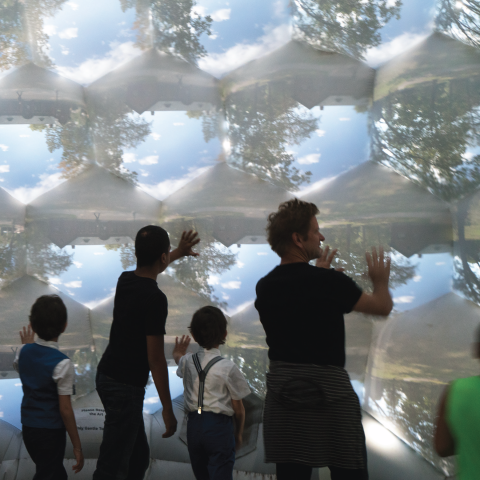 People stand inside the compound camera.