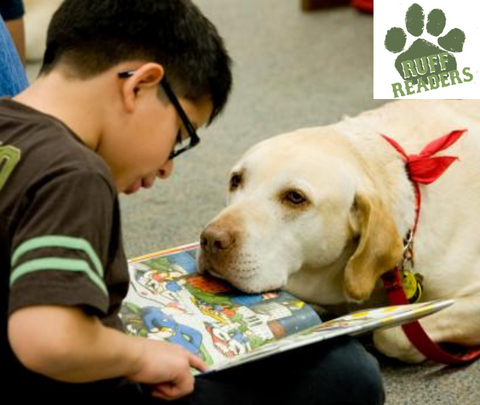 image of a child reading to a dog