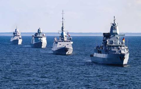 image of a row of ships in the ocean