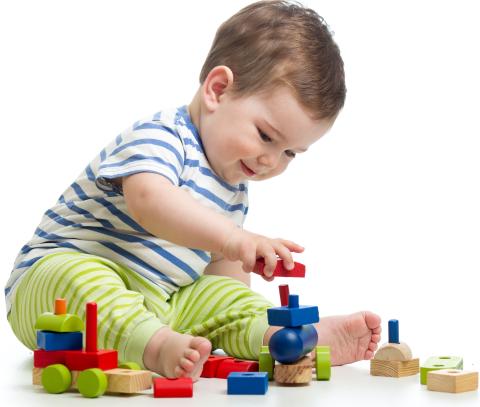 image of a baby playing with blocks