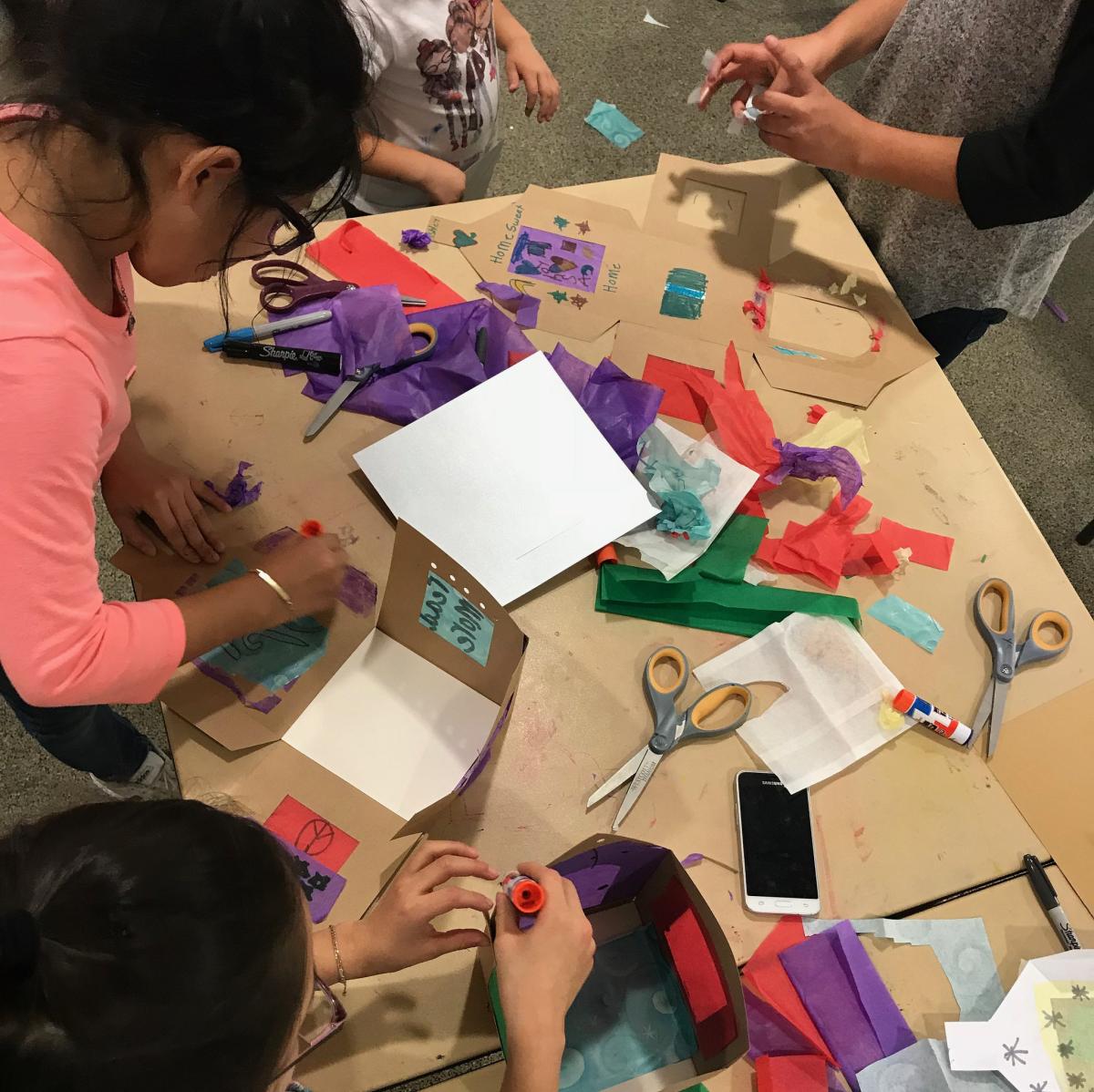 children working on a craft project